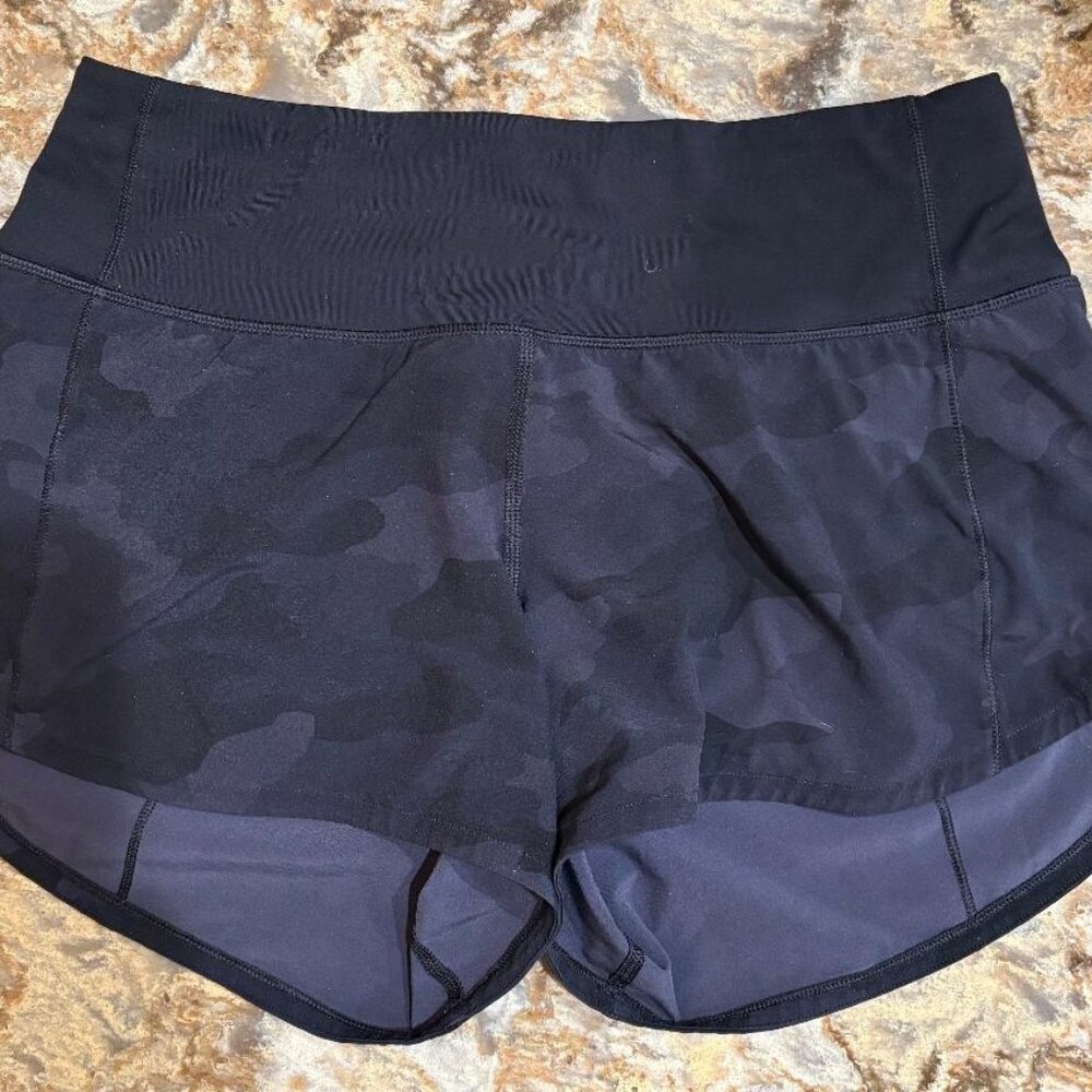 Lululemon SpeedUp Short. Hi Rise, Size 4 Tl. 2.5 inch inseam. Black camouflage.